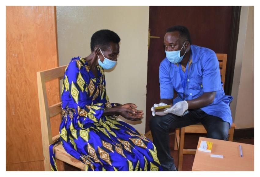 Community health worker, Venuste, tests