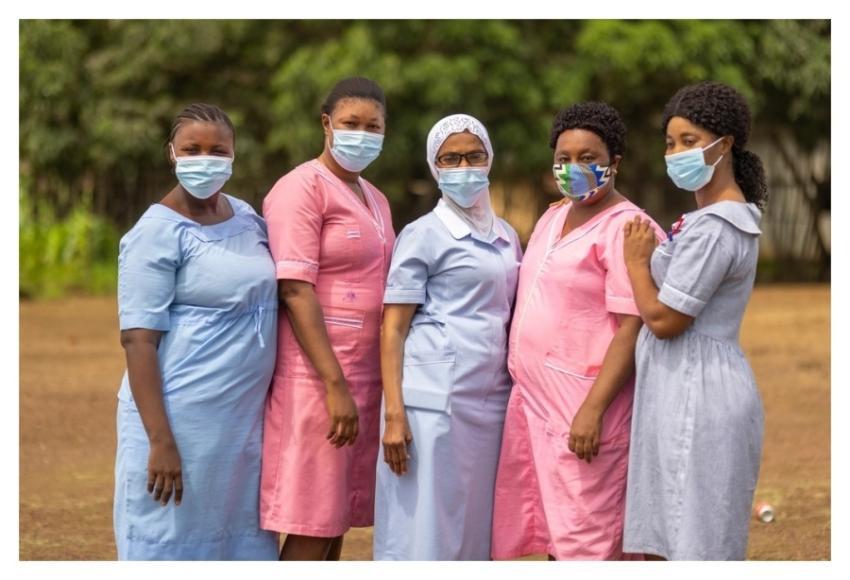 Nurses pose outside health center
