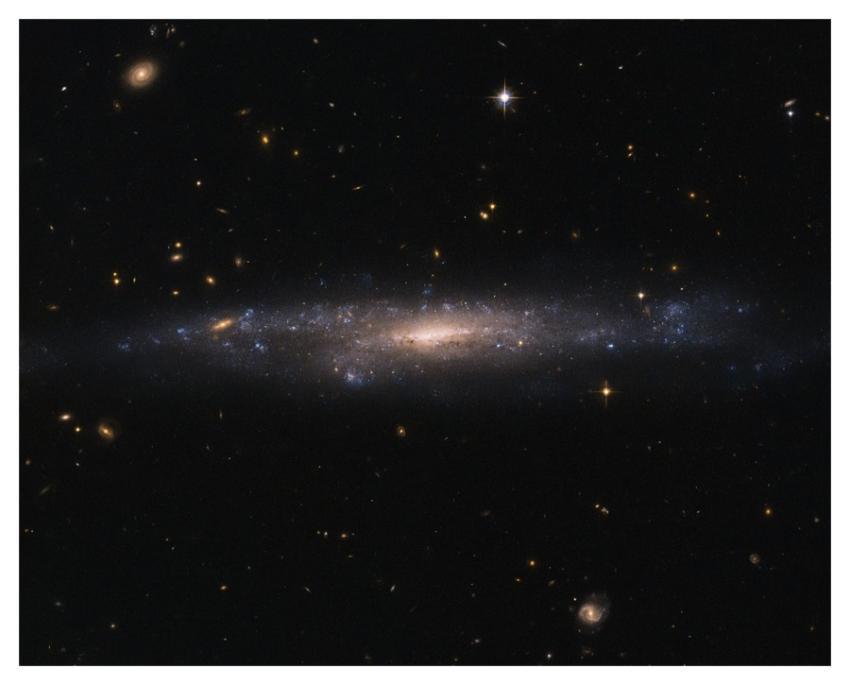 Hubble Sees Galaxy Hiding in the Night Sky