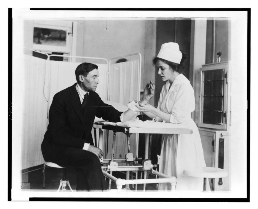 Public Health Service nurse treating