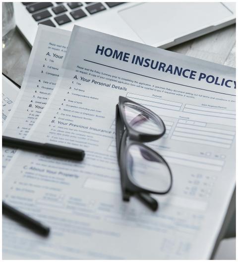 Close-up of home insurance policy document with gl