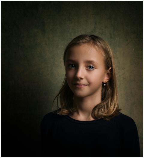Charming studio portrait of a young girl with a su