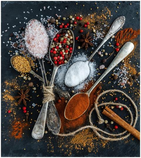 Assorted spices and seasonings arranged creatively