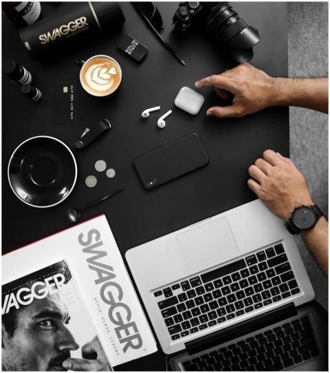 A contemporary workspace featuring tech devices, c