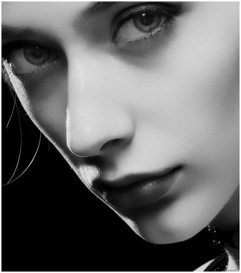 Black and white close-up portrait of a woman with