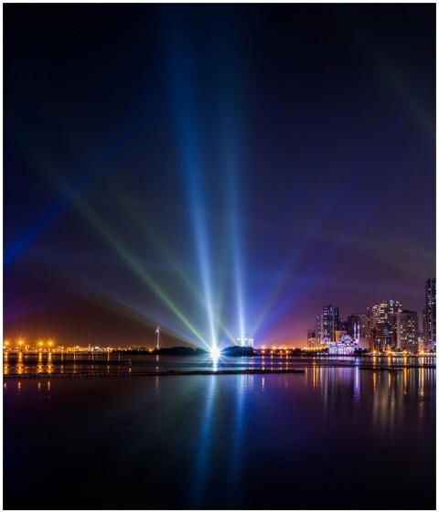 Stunning view of Sharjah skyline at night with vib