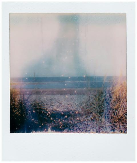 Vintage-style Polaroid capturing a hazy, dreamy be