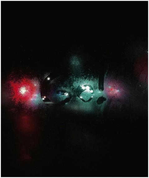 Misty window with 'Go!' written, illuminated by co