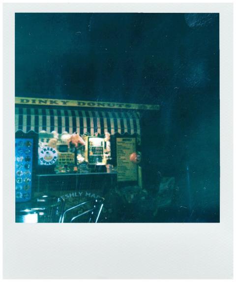 A nostalgic night street view of a vintage donut s