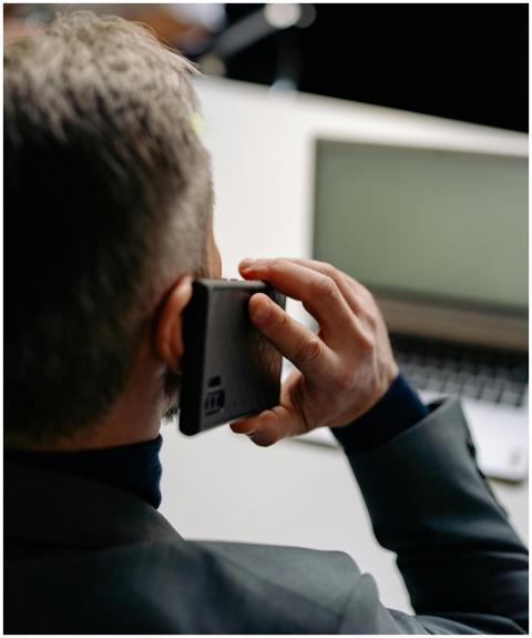 Businessman making a phone call while working on a