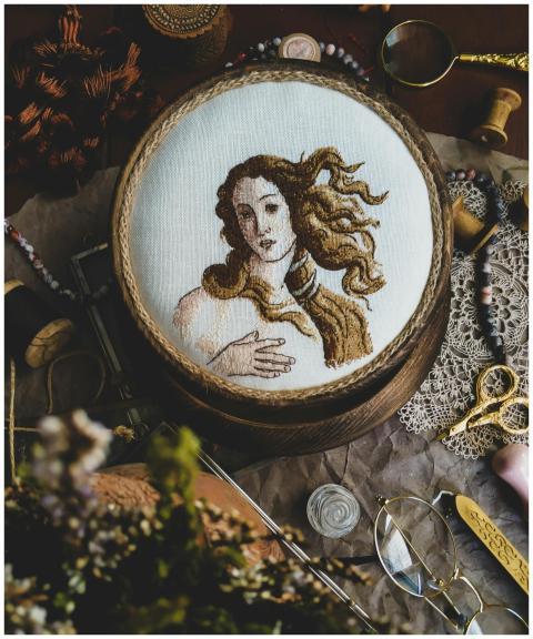 A detailed embroidery of a classical artwork captu