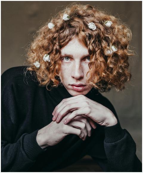 A captivating portrait of a young redhead wearing