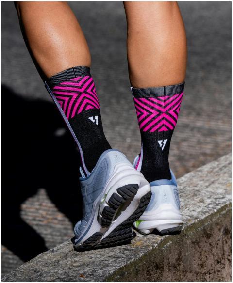 Vibrant running socks and sneakers on a jogging tr