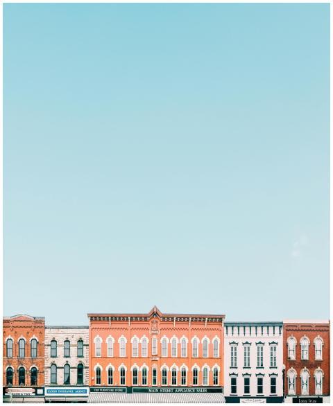 Vivid storefronts in a quaint small town against a