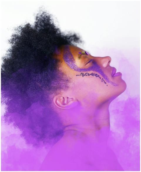Artistic side profile of a woman with face paint a