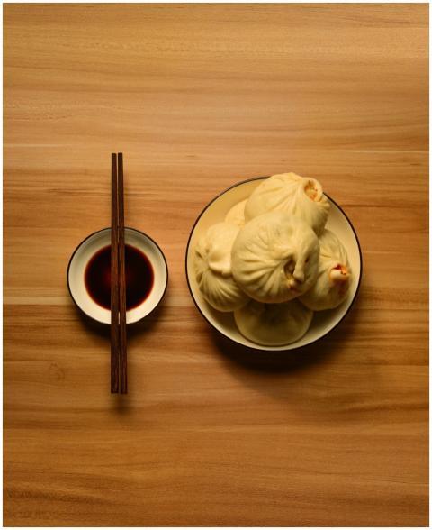 Steamed Chinese dumplings served with soy sauce an