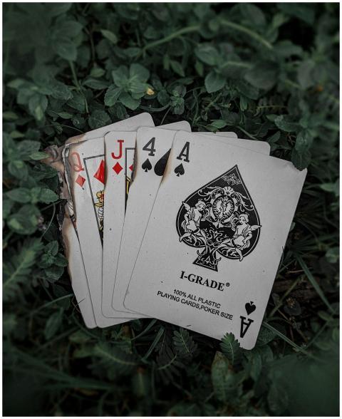 A close-up view of playing cards including ace and