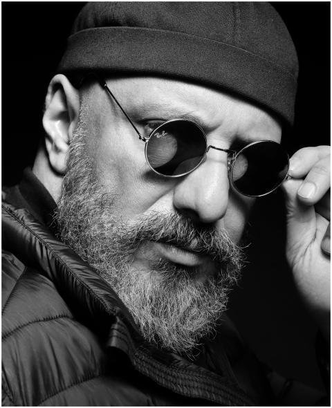 Dramatic black and white portrait of a bearded man