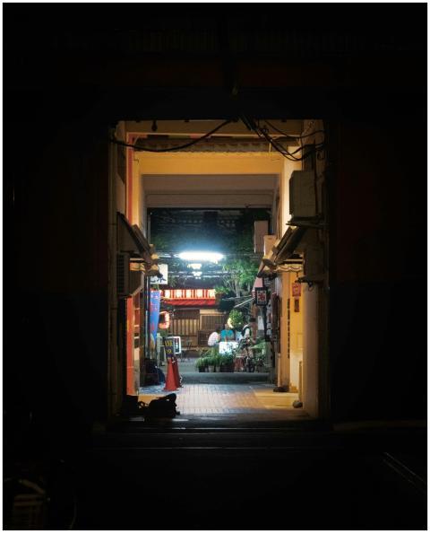 A captivating night view of an illuminated alleywa