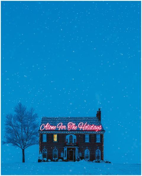 A brick house decorated with 'Alone For The Holida