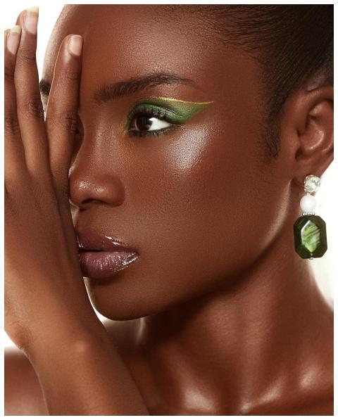 Close-up portrait of a woman with vibrant makeup a