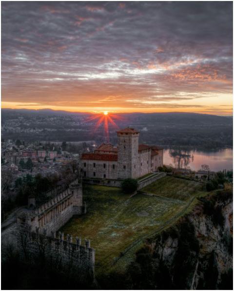 A breathtaking sunrise over Rocca Borromeo Castle