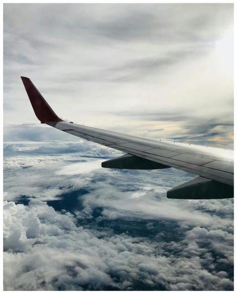 A stunning aerial view of fluffy clouds and an air