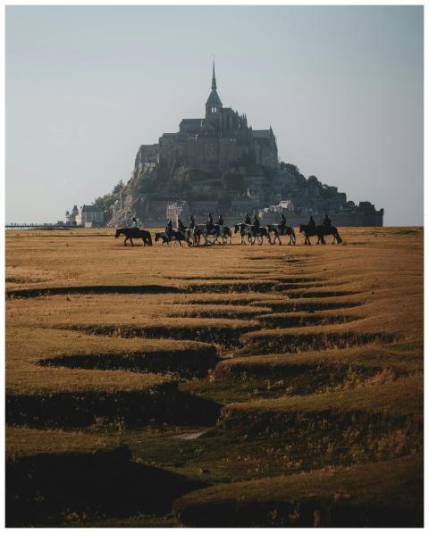 A beautiful scene of horseback riders with Mont-Sa