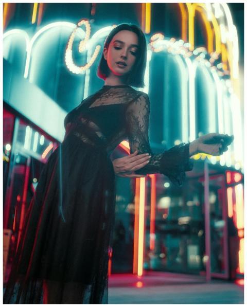 Chic street fashion portrait with neon lights in I