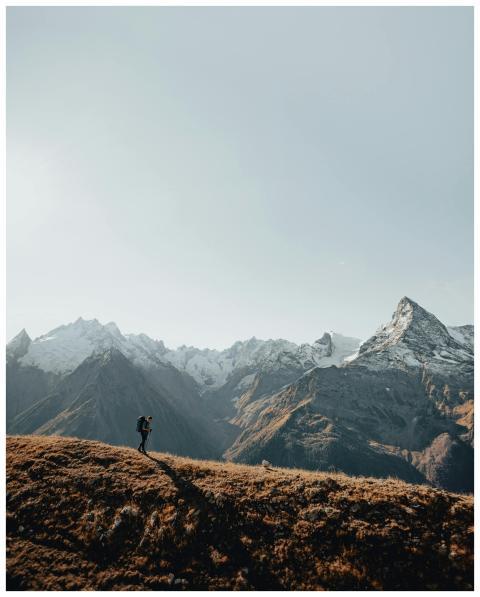 Hiker explores the dramatic, scenic mountains of t