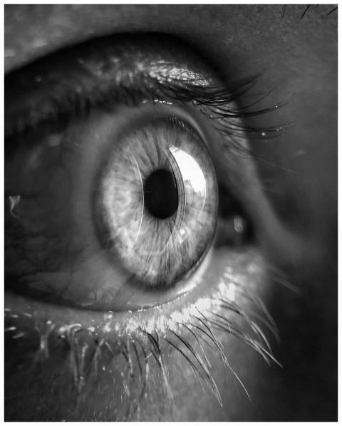 Macro shot of a human eye in black and white, show