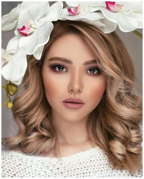 A stunning portrait of a woman adorned with a flor