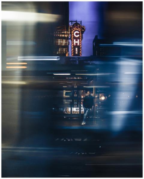 Blurred cityscape at night featuring Chicago's ico