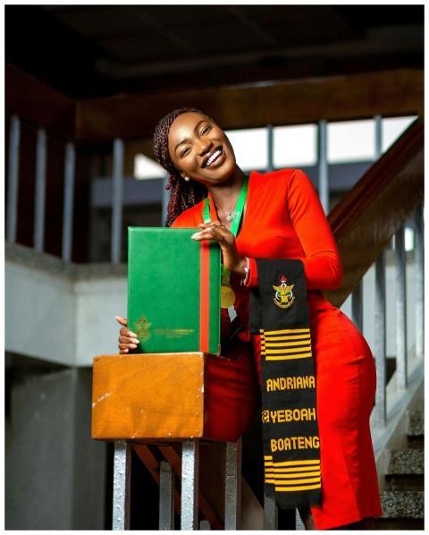 Graduate Celebrates Diploma Red