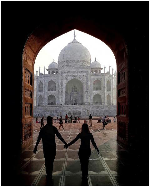 Back view of silhouette of loving traveling couple