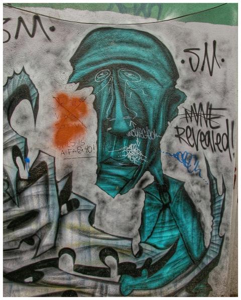 Colorful urban street art featuring abstract human