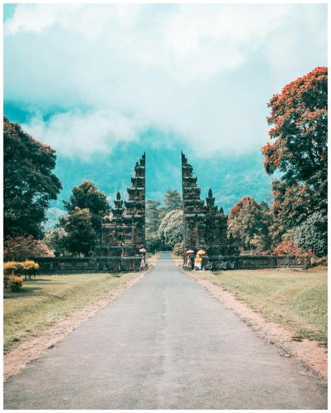 Majestic Balinese gate amidst a lush, tropical lan