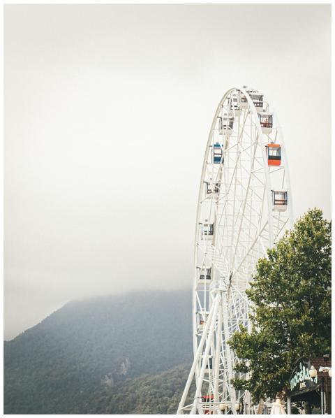 Majestic Ferris wheel shrouded in fog in Sochi, Ru