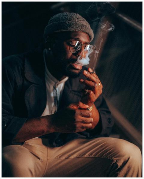 Close-up of a fashionable man smoking a cigarette,