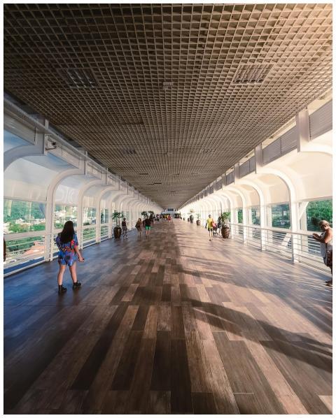 Sunny day on a modern footbridge in Balneário Camb
