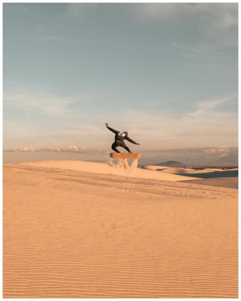 Captivating sandboarding action against Cape Town'