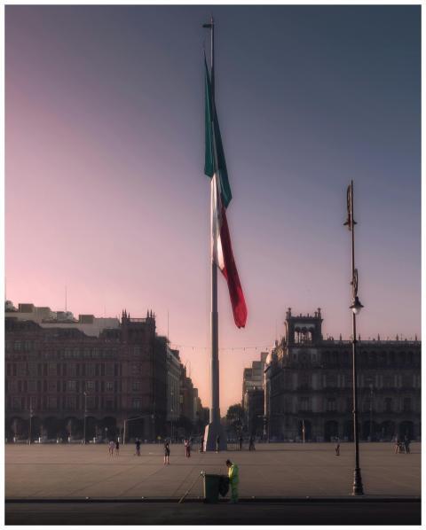 The Mexican flag hoisted prominently at Zócalo Squ