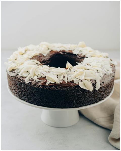 Mouth-watering chocolate cake topped with white ch