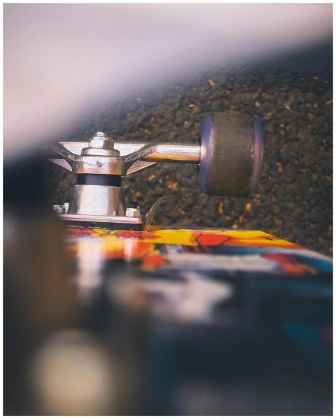 Detailed shot of skateboard wheel and deck surface