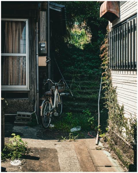 Charming alleyway in Japan with a vintage bicycle
