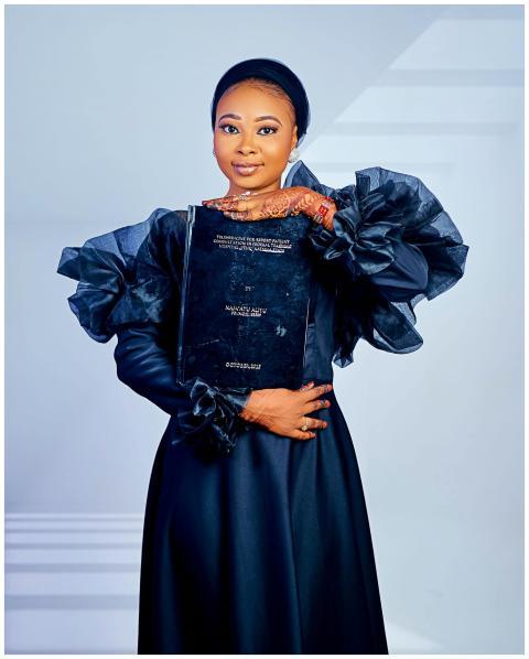 Elegant Woman Holding Book