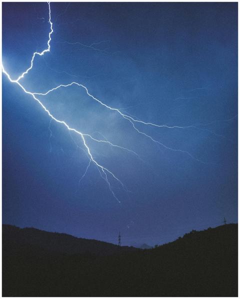 Majestic lightning bolts illuminate the night sky