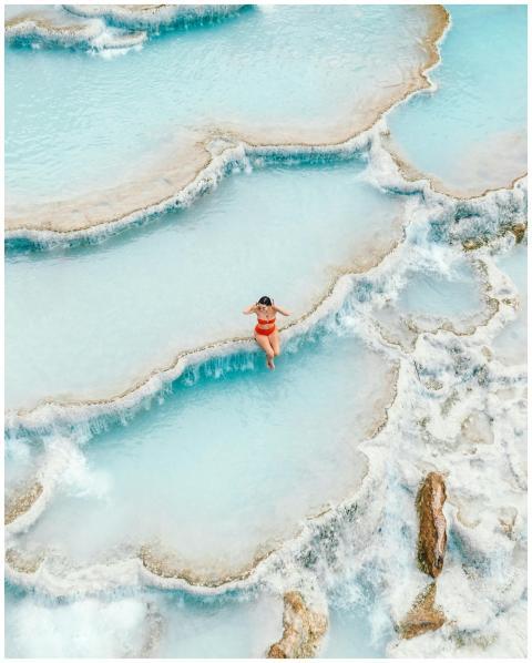 A woman enjoys a peaceful moment in Saturnia's stu