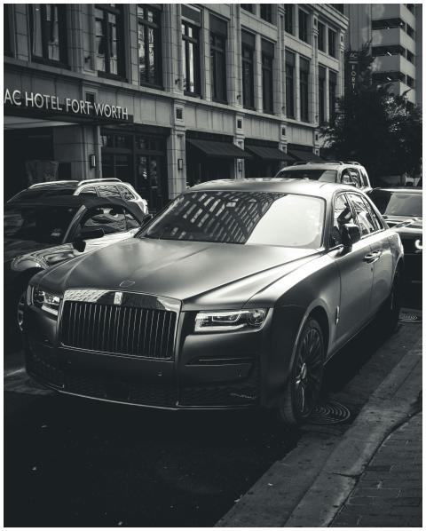 Elegant Rolls-Royce parked on a busy street in For