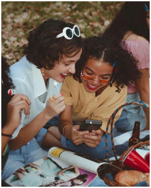 A group of happy young women enjoying a sunny picn